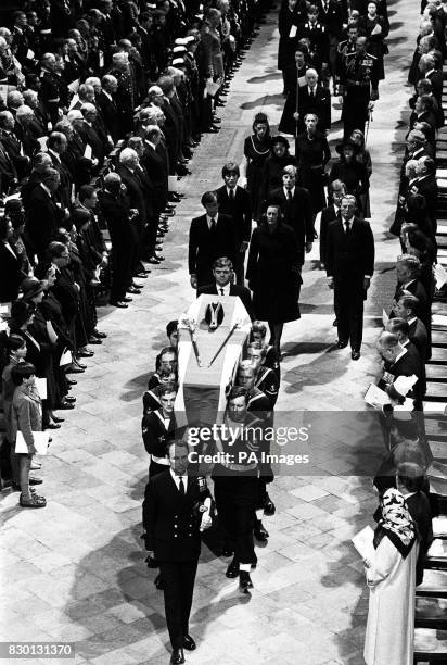 The flag-draped coffin of Earl Mountbatten is carried out of Westminster Abbey, London, by a Royal Navy bearer party following the Earl's funeral...