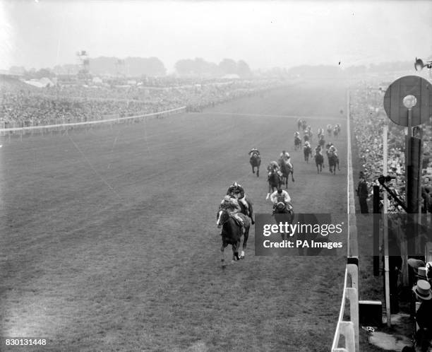 The finish of the Derby Stakes at Epsom, Surrey: Never Say Die , ridden by Lester Piggott, leads from Arabian Night , ridden by Tommy Gosling, and...