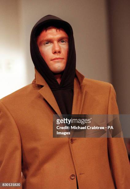 Model presents a casual jacket over black hooded top from the 'Psyche' Spring/Summer fashion collection at the Royal Horticultural Halls during...