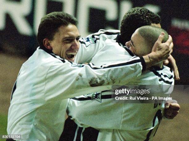 This picture can only be used within the context of an editorial feature. Derby County's Stefano Eranio and Francesco Baiano hug Deon Burton after...