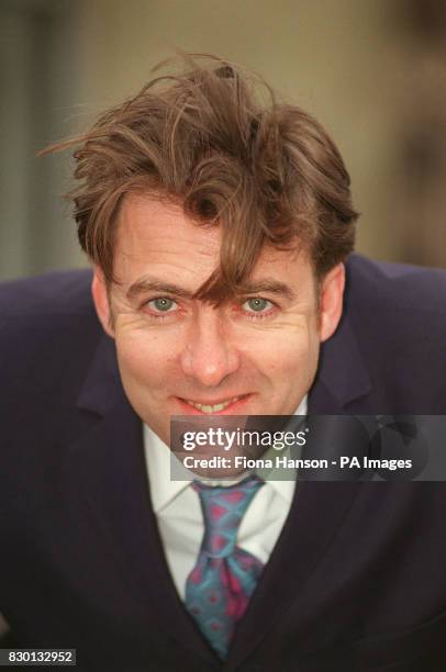 Presenter Jonathan Ross during a photocall in Camden, north London, after taking delivery of his new Alabaster Vespa ET 2 scooter. * 13/02/01...