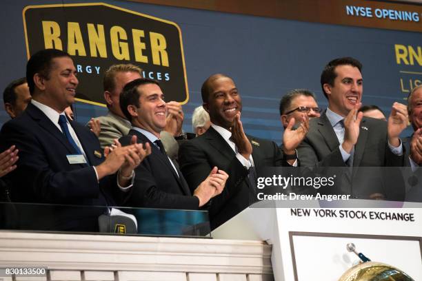 Darron M. Anderson , president and chief executive officer of Ranger Energy Services, applauds after ringing the opening bell to celebrate his...