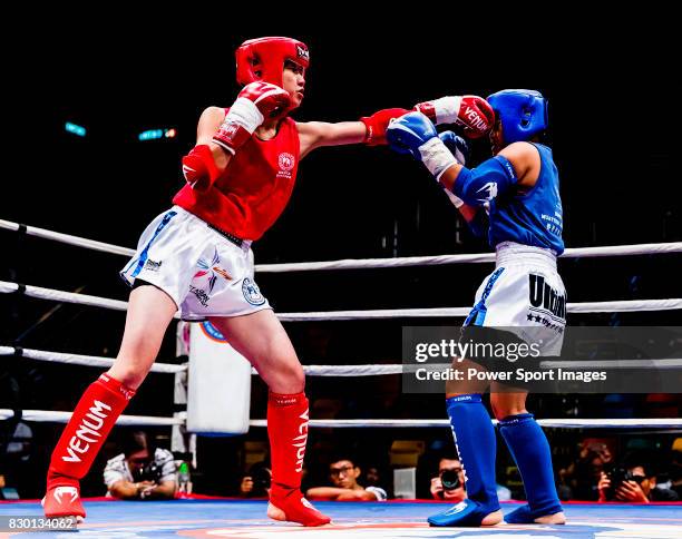 Jimpo Yurika of Japan fights against Yeh Hui Tzu of Taiwan in the female muay 48KG division weight bout during the East Asian Muaythai Championships...