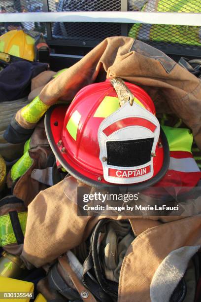 firefighter's helmet, protective gear and equipment - feuerwehrhelm stock-fotos und bilder