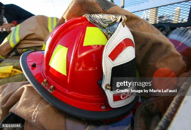 firefighter's helmet, protective gear and equipment - fireman uniform stock pictures, royalty-free photos & images