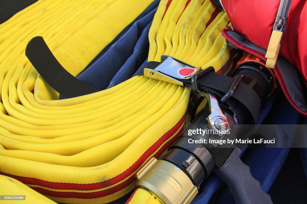 Close up of firefighter's water hose