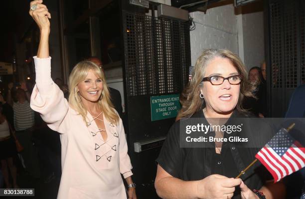 Christie Brinkley and Rosie O'Donnell walk in a parade of celebration to the opening night party for "Michael Moore: "The Terms Of My Surrender" on...