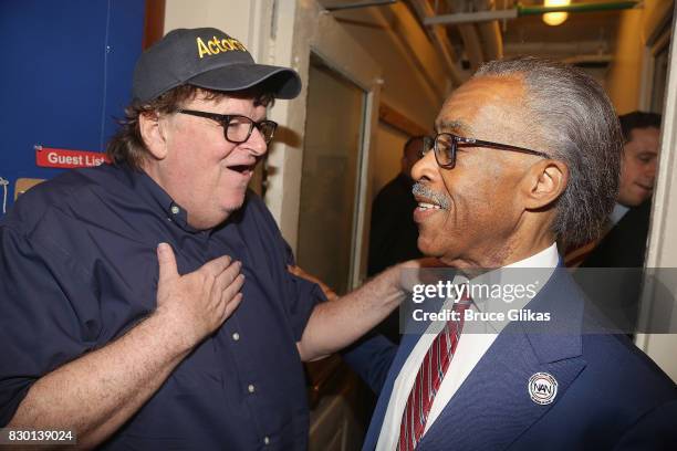 Michael Moore and Al Sharpton chat backstage at the opening night of "Michael Moore: "The Terms Of My Surrender" on Broadway at The Belasco Theatre...