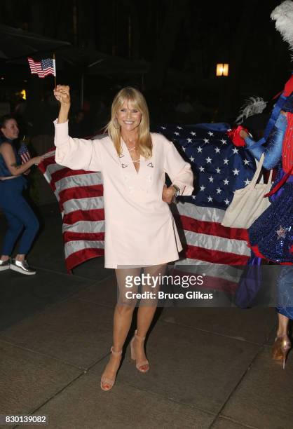Christie Brinkley poses during a parade of celebration to the opening night party for "Michael Moore: "The Terms Of My Surrender" on Broadway at The...