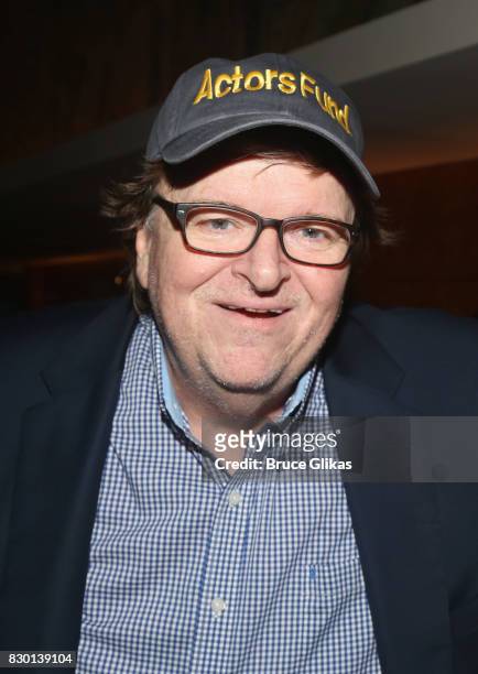 Michael Moore poses at the opening night after party for "Michael Moore: The Terms Of My Surrender" on Broadway at Bryant Park Grill on August 10,...