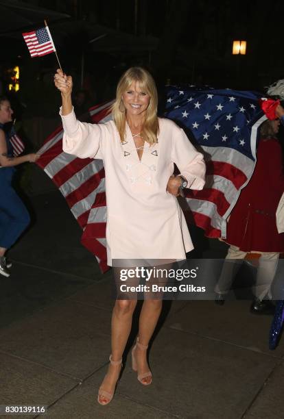 Christie Brinkley poses during a parade of celebration to the opening night party for "Michael Moore: "The Terms Of My Surrender" on Broadway at The...
