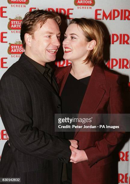 Actress Kate Winslet and new husband Jim Threapleton at the Empire Film Awards in London where she was named Best British Actress for her role in...