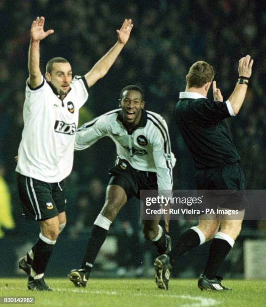 This picture may only be used within the context of an editorial feature. Referee Paul Durkin avoids Francesco Baiano celebrating with team-mate...