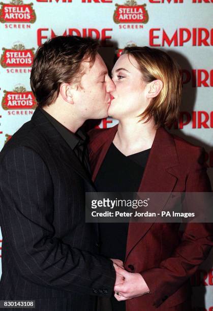 Kate Winslet kisses new husband Jim Threapleton at the Empire Film Awards in London, after winning Best British Actress award for her role in Titanic.