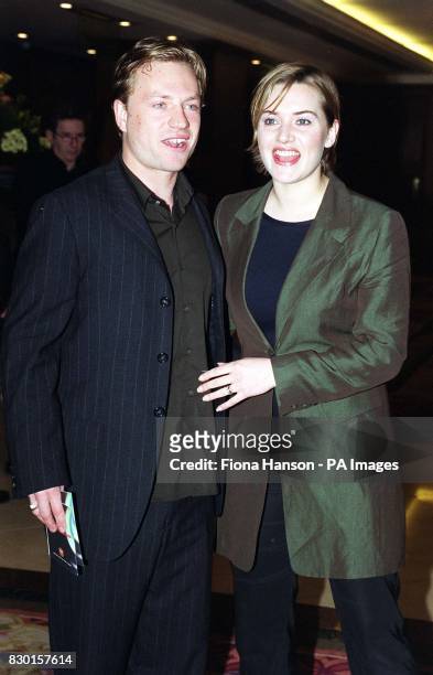 Actress Kate Winslet and her husband Jim Threapleton arrive at the Royal Lancaster Hotel in London for the Capital FM 1999 London Awards lunch.