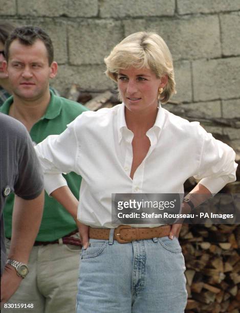 Diana, Princess of Wales, and her butler, Paul Burrell , meeting Bosnian Serbs and Muslims affected by landmines near Tuzla during the second day of...