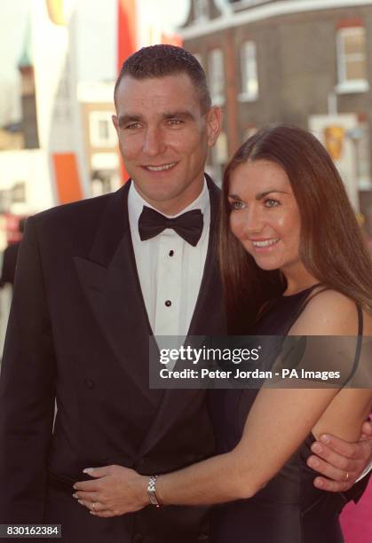 Vinnie Jones and his wife, Tanya arrive at the 51st BAFTA Film Awards at the Business Design Centre in London.