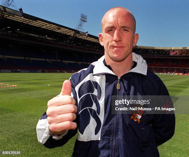 London Broncos rugby league captain Shaun Edwards, gives the thumbs up with his injured hand during a photocall at Wembley, ahead of their Challenge...