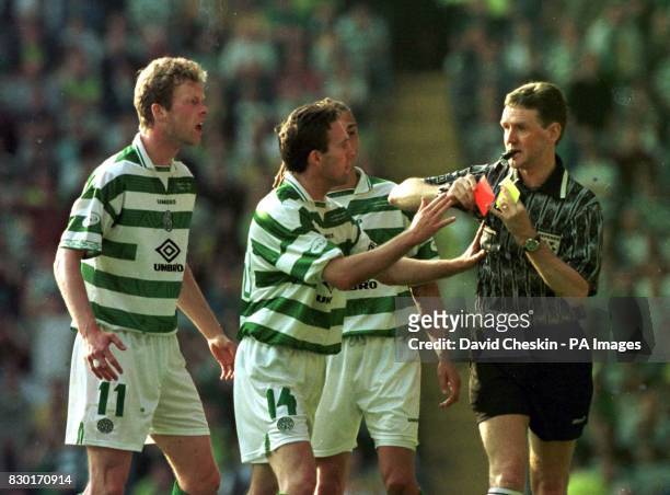 Referee Hugh Dallas ignores the pleas of Celtic`s Paul Lambert and Morten Wieghorst and gives their team mate Stephane Mahe a red card in the...