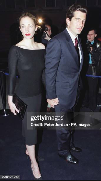 John Kennedy Jr, son of former US President John F Kennedy, arrives with his wife Carolyn Bessette-Kennedy for a party celebrating the opening of a...