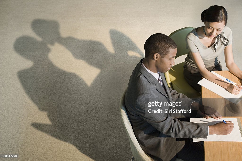 Office workers with revealing shadows