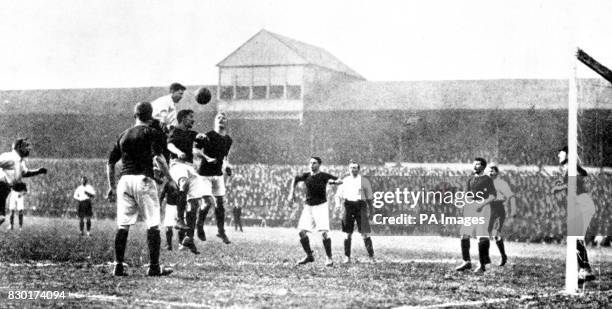 England play Scotland at football, at Bramall Lane, Sheffield, in 1903. Vivian Woodward for England heads the ball towards goal. Scotland won 2-1.
