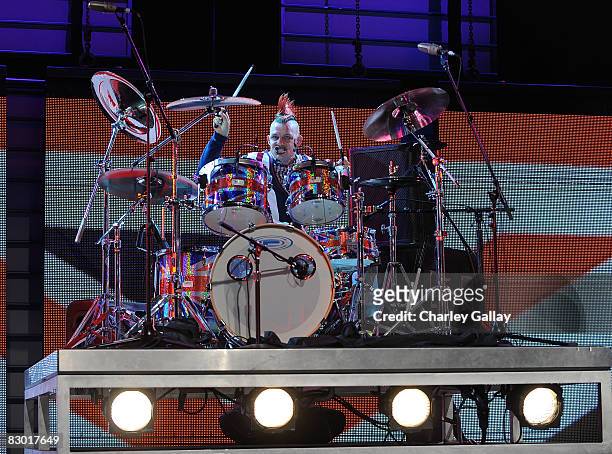 Drummer Adrian Young performs during a fashion show at the Macy's Passport 2008 Gala at Santa Monica Airport's Barker Hangar on September 25, 2008 in...