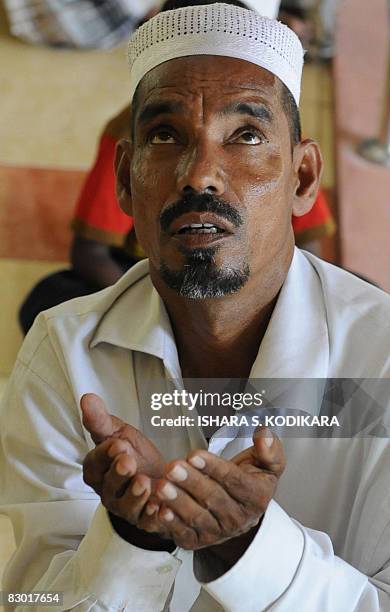 Sri Lankan Muslim prays at a mosque in Colombo's Maradana area on September 26, 2008 in preparation for Eid al-fitr. The festival, which begins after...