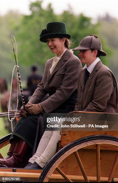Lady Romsey laughs as she drives her pony tandem cart at the Royal Windsor Horse Show at Windsor, Berkshire.