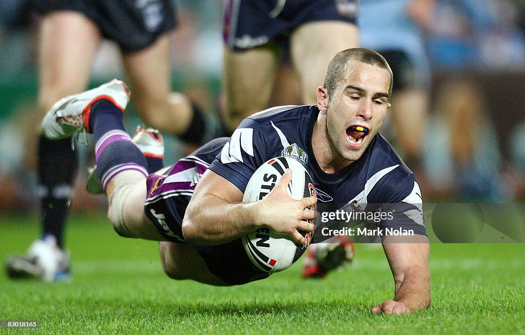 Nolan Stringer Steve Turner of the Storm scores a try during the first NRL... News ...