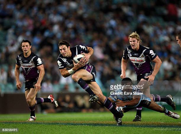Billy Slater of the Storm breaks free on a play that led to a try by Matt Geyer the first NRL Preliminary Final match between the Cronulla Sharks and...