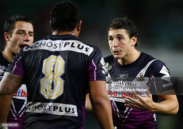 Billy Slater of the Storm reacts to team mate Jeff Lima during the first NRL Preliminary Final match between the Cronulla Sharks and the Melbourne...