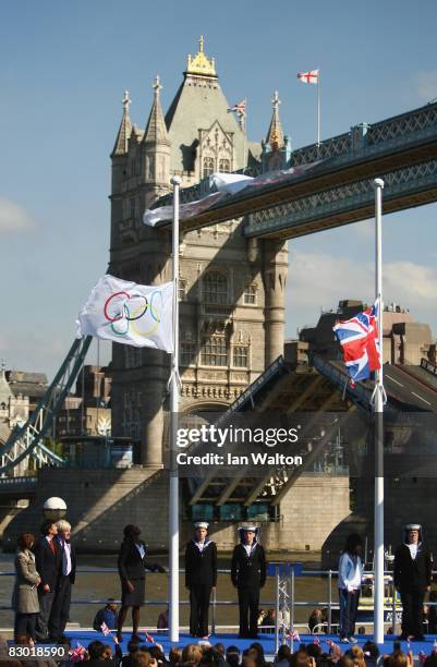 Olympic 400metres champion Christine Ohuruogu raises the Olympic flag during the raising of the Olympic and Paralympic flags outside London City Hall...