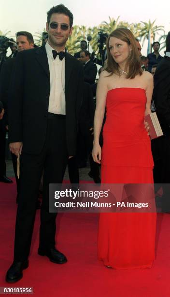Jeremy Northam and Julianne Moore arrive at the Palais des Festivals for the closing premiere "An Ideal Husband", directed by Oliver Parker on the...