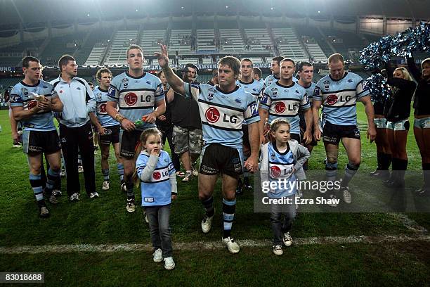 Brett Kimmorley of the Sharks waves to the crowd after losing the first NRL Preliminary Final match between the Cronulla Sharks and the Melbourne...