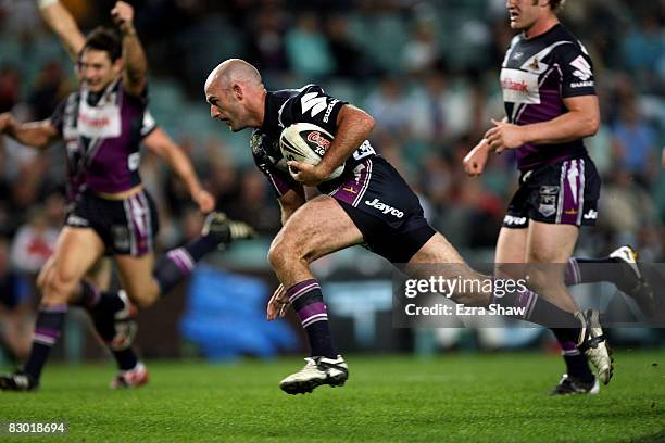 Matt Geyer of the Storm runs in for a try during the first NRL Preliminary Final match between the Cronulla Sharks and the Melbourne Storm held at...