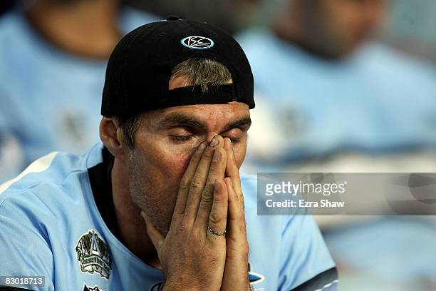 Sharks fan looks dejected after the Storm scored another try during the first NRL Preliminary Final match between the Cronulla Sharks and the...