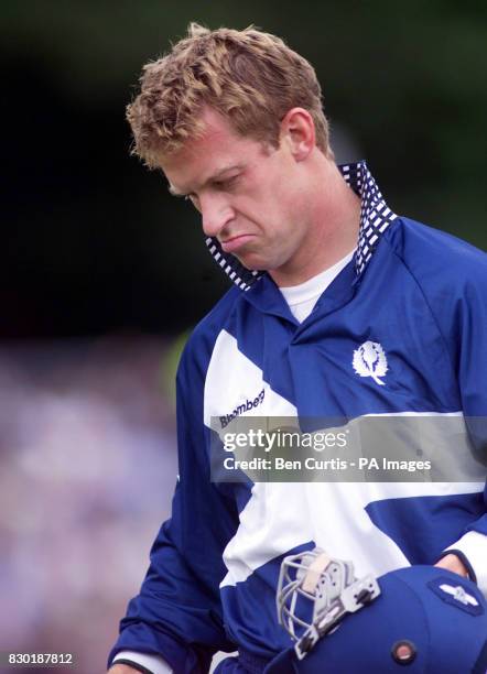 Disappointed Scotland batsman Mike Allingham walks off after being caught out against New Zealand, during the Cricket World Cup 1999 match at the...