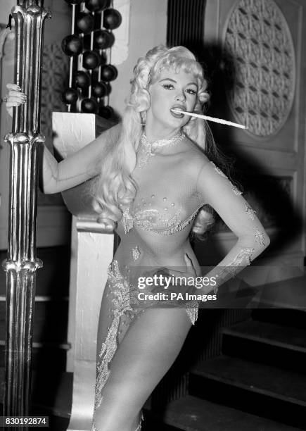 American actress Jayne Mansfield as she appears in a nightclub scene from the film "Too Hot To Handle", being made at MGM's Elstree Studios, Herts.