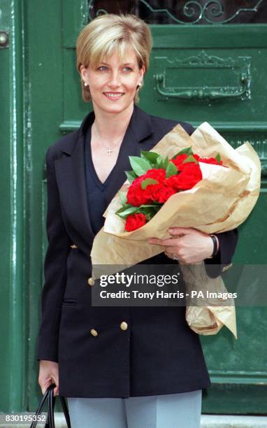 Royal bride-to-be Sophie Rhys-Jones, leaves her office, R-JH Public Relations, in Mayfair, central London, holding two dozen red roses, bought for...