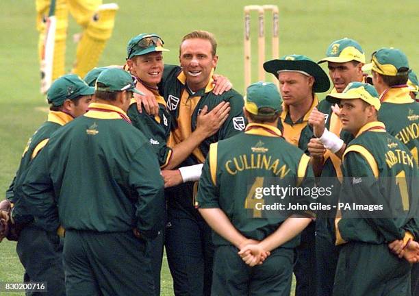 South African bowlers Shaun Pollock and Allan Donald congratulate each other after ripping through the Australian batting in their World Cup cricket...