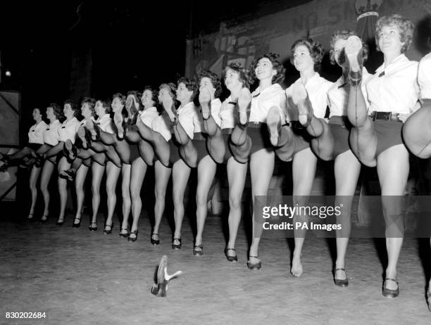 Shoe, having been flung off during dancing, lies on the stage in front of the John Tiller Girls during their rehearsals at the Victoria Palace,...