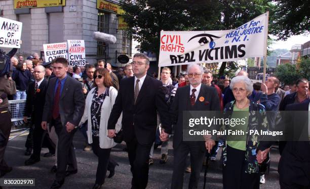 Jim Dixon, who was seriously injured in the Enniskillen Poppy day bomb , and wife Anna lead the Protestant civil rights marchers on their way through...