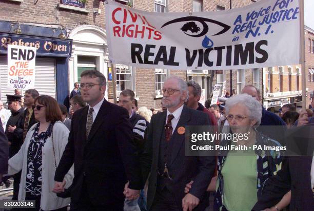 Jim Dixon, who was seriously injured in the Enniskillen Poppy day bomb , and wife Anna lead the Protestant civil rights marchers on their way through...