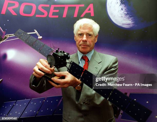 European Space Agency Director of Science Prof Roger Bonnet at a press conference in London, with a model of the Rosetta spacecraft which is...