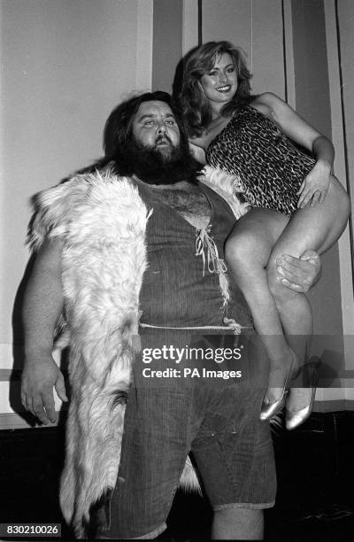 Wrestler Giant Haystacks with Page 3 girl Gina Charles at London's launching of Batchelor's/RADAR .