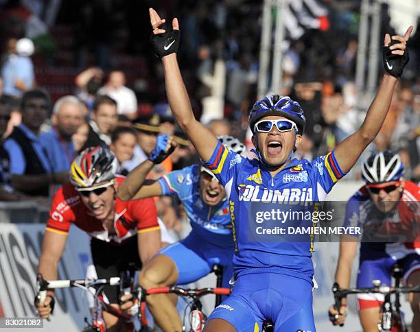 Colombian Fabio Andres Duarte Arevalo celebrates as he crosses the finish line of the road race men under-23 at the 2008 UCI road world championships...