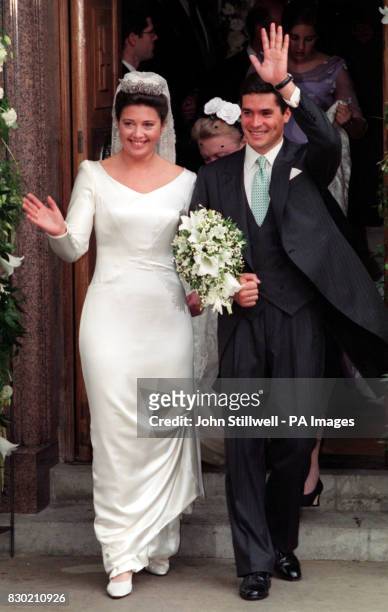 Princess Alexia of Greece and Carlos Morales Quintana of Spain wave to the crowds from he steps of the Greek Orthodox Cathedral of St Sophia in...