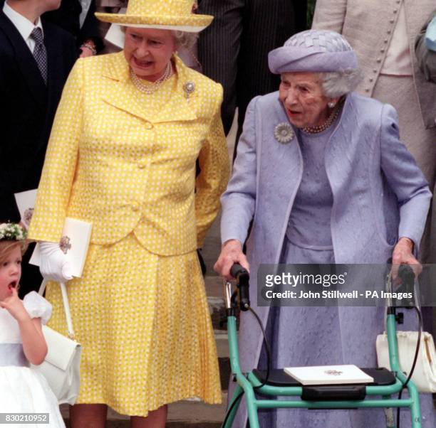 Queen Ingrid of Denmark and Britain's Queen Elizabeth II watch as Princess Maria Olympia yawns on the steps of the Greek Orthodox Cathedral of St...