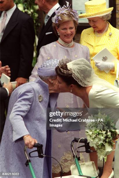 Princess Alexia of Greece kisses Queen Ingrid of Denmark after the Princess' wedding to Carlos Morales Quintana of Spain in the Greek Orthodox...